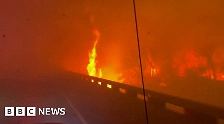 Fire truck drives through raging Texas wildfire