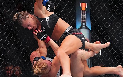 Harrison meets hype, taps out Holm in UFC debut