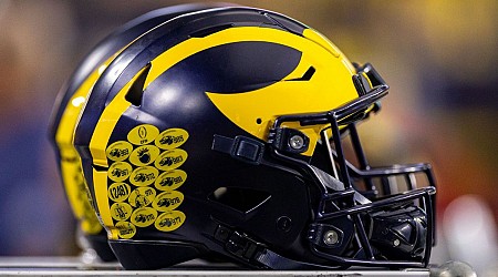 Michigan reaches settlement with NCAA for recruiting violations
