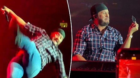 Luke Bryan falls on stage after slipping on fan’s cell phone
