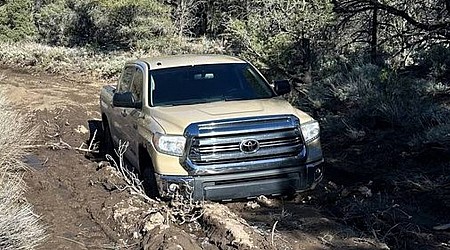 Driver gets stuck in mud on closed Death Valley road, photo shows. Rangers warn others