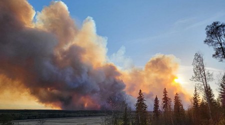 Unwieldy wildfires scorch Canada and threaten catastrophe-scarred Fort McMurray with more flames