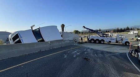 Overturned strawberry truck causes jam on two highways