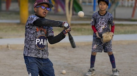 Baseball becomes a shelter for Venezuelan children in soccer-mad Peru