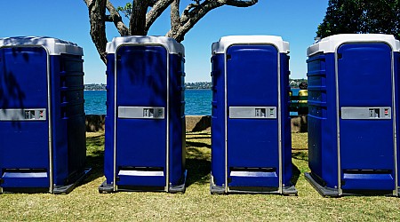 Man charged with flipping port-a-potty, trapping woman, child inside