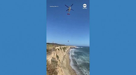 WATCH: Kite surfer stranded on beach uses rocks to spell out 'HELP' in the sand