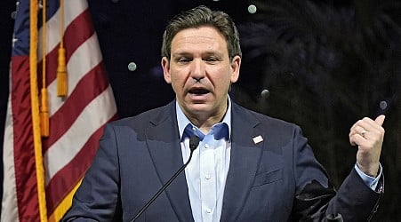 Florida Gov. Ron DeSantis signs a bill that strikes climate change from state law