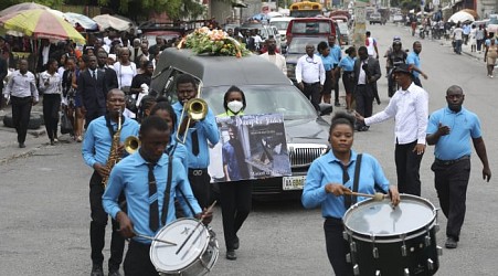 Hundreds mourn gang killings of a Haitian mission director and a young American couple