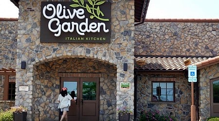 Olive Garden's parent company says it's luring diners in by not raising prices as much as rivals — even if it's not offering hefty discounts