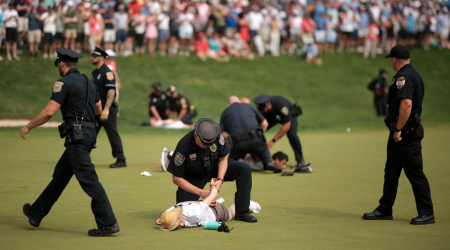 Protesters with smoke bombs tackled after interrupting 72nd hole of 2024 Travelers Championship