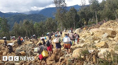 Race to rescue villagers trapped in landslide