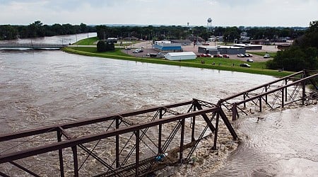 Wading Through Neck-high Waters in Iowa, a Husband Implored His Wife to Keep Going