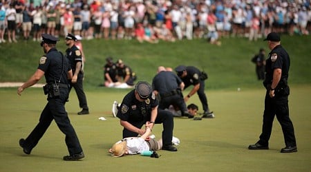 Climate protesters disrupt play at 18th hole of PGA Tour’s Travelers Championship