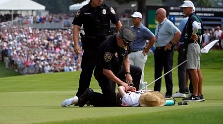 Six climate protesters run onto 18th green and spray powder, delaying finish of PGA Tour event