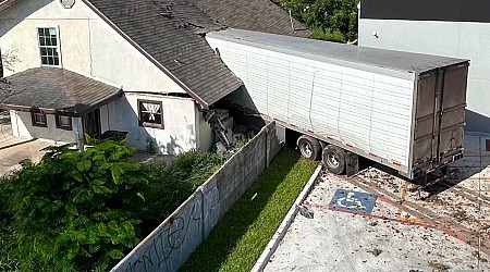 Truck driver dead after 18-wheeler crashes into home