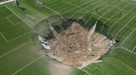 Giant sinkhole swallows part of Illinois soccer field where children often play