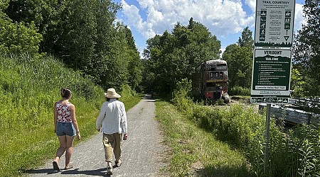 Hikers and cyclists can now cross Vermont on New England's longest rail trail, a year after floods