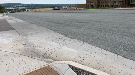 Dozens of drivers impacted by busy Colorado Springs intersection chip sealing melting