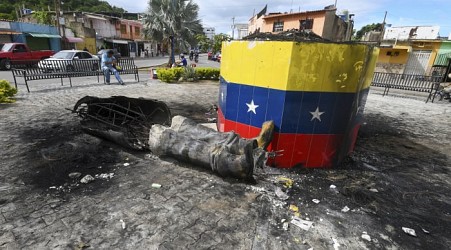 Hugo Chavez statues targeted across Venezuela in post-election unrest