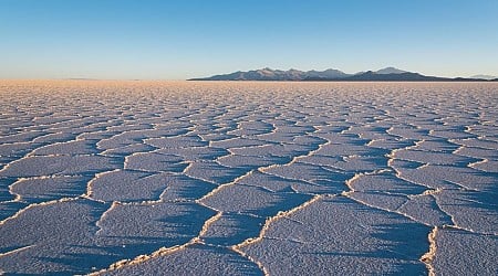 Salar de Uyuni: The world's largest salt desert and lithium reservoir surrounded by volcanoes