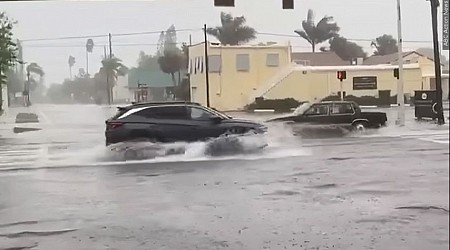 Tropical Storm Debby swirls over Atlantic, still dumping rain on the Carolinas before moving north