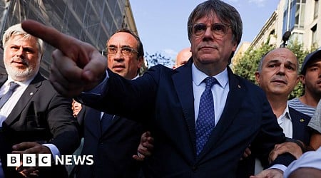 Police hunt ex-Catalan separatist leader after return from exile