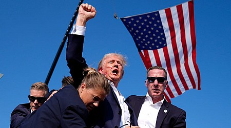 Donald Trump is escorted from stage after pops heard during Pennsylvania rally