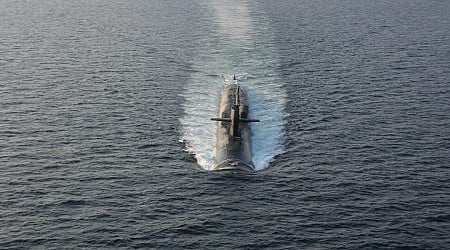 An unusual announcement about a US Navy submarine packed with cruise missiles is a loud message that puts Iran on notice