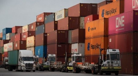 US port workers meet on wages, issue fresh strike threat