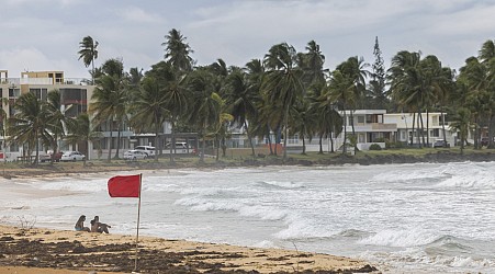 Ernesto, now a hurricane, is drenching Puerto Rico and knocking out power