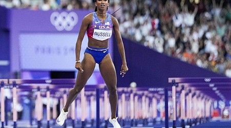 American Masai Russell wins Olympic gold in 100m hurdles by a 100th of a second