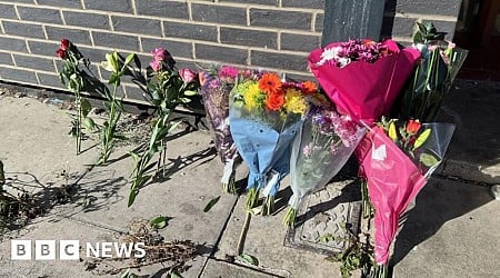 Tributes left as teen held over tower block deaths