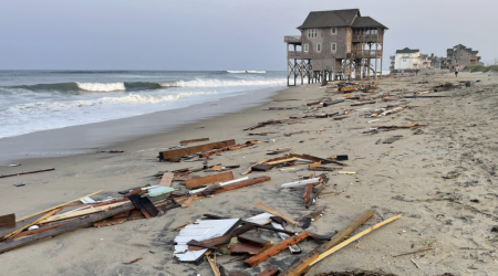 Outer Banks home falls into the ocean, highlighting a grim trend. See the photos.