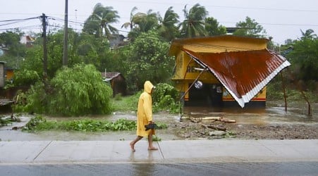 John as a tropical storm hits Mexico's Pacific coast a 2nd time