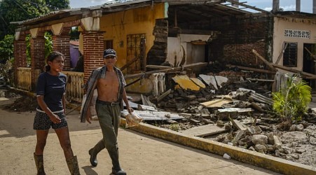 Along Mexico's Pacific coast, flooding from Hurricane John left devastated towns and 15 dead