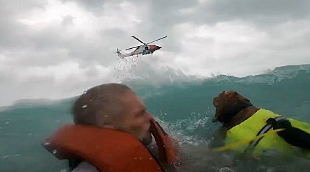 Dramatic video shows US Coast Guard rescue a man and his dog after their boat started sinking during Hurricane Helene