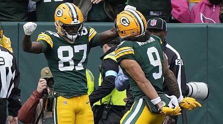 Doubs catches 2 TD passes in his return from a suspension to help Packers rout Cardinals 34-13