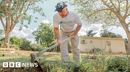 Keeping lawns neat in front of burned homes - a year on at kibbutz where Hamas killed 101