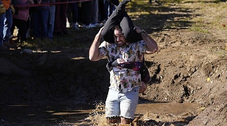 Wife-carrying championship victory brings beer, cash