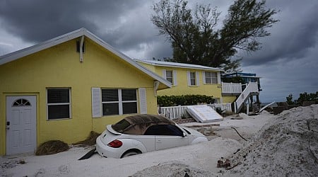 Florida digs out of mountains of sand swept in by back-to-back hurricanes