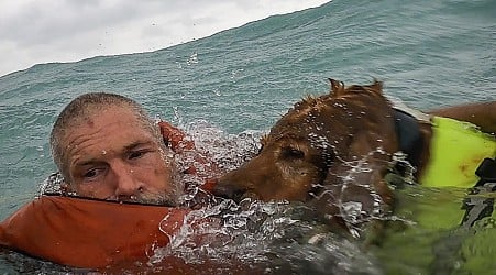 The Coast Guard save a man and his dog from a sinking boat off the coast of Florida