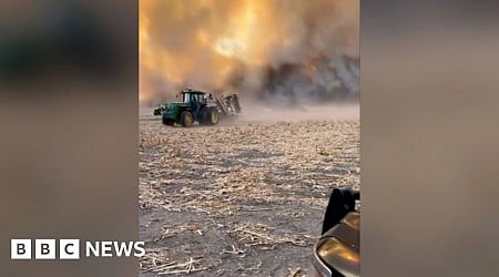 Farmers seen fleeing Nebraska wildfire during harvest