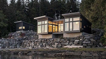 A New Home Overhanging The Water's Edge In Alaska