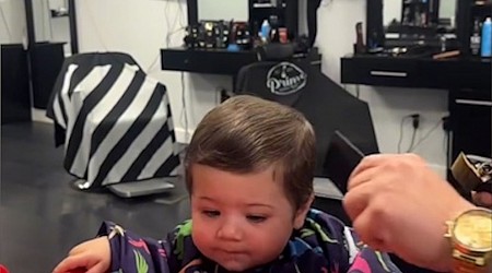 WATCH: Baby nervous for his 1st haircut brings dog along for support