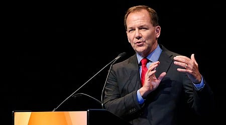 Legendary investor Paul Tudor Jones says he's buying gold and bitcoin pre-election because inflation will rise under both Trump and Harris