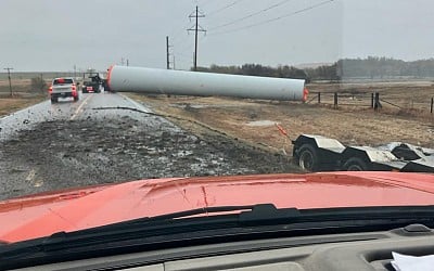 Semi hauling windmill tower loses load on K-156 highway