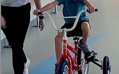 WATCH: 7-year-old with rare genetic condition rides bike for 1st time