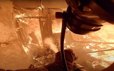 Intense POV Footage Shows Brave Firefighter Extinguish a Burning Building