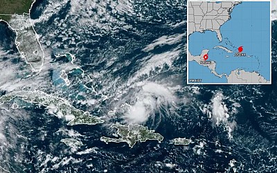 Hurricane Oscar brushes past Turks and Caicos and heads toward Cuba