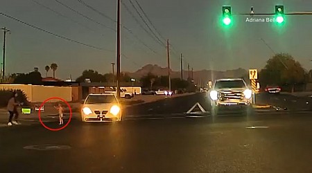 Toddler nearly hit after running into busy Arizona intersection, video shows